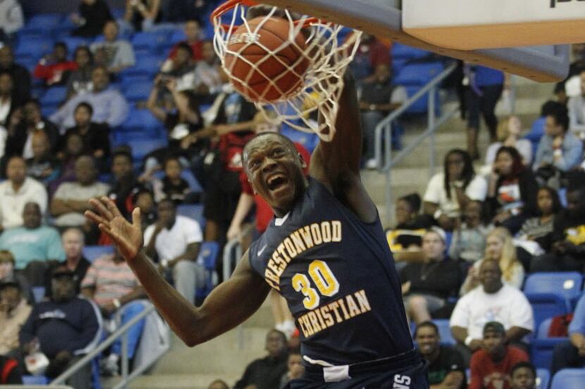 Prestonwood's  Julius Randle (30) dunks over Madison Prep Academy 's Delvin Spann (32)...