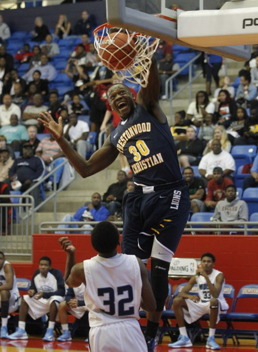 Prestonwood's  Julius Randle (30) dunks over Madison Prep Academy 's Delvin Spann (32)...