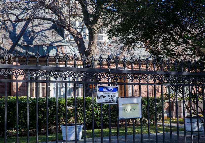 Signs on the Deloache Avenue side also warn people to stay away from the house that's now...