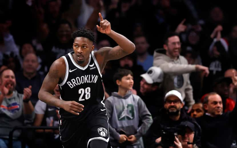 Brooklyn Nets forward Dorian Finney-Smith (28) reacts after scoring against the Detroit...