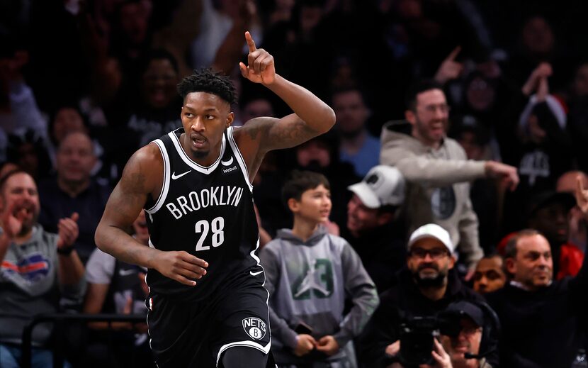 Brooklyn Nets forward Dorian Finney-Smith (28) reacts after scoring against the Detroit...