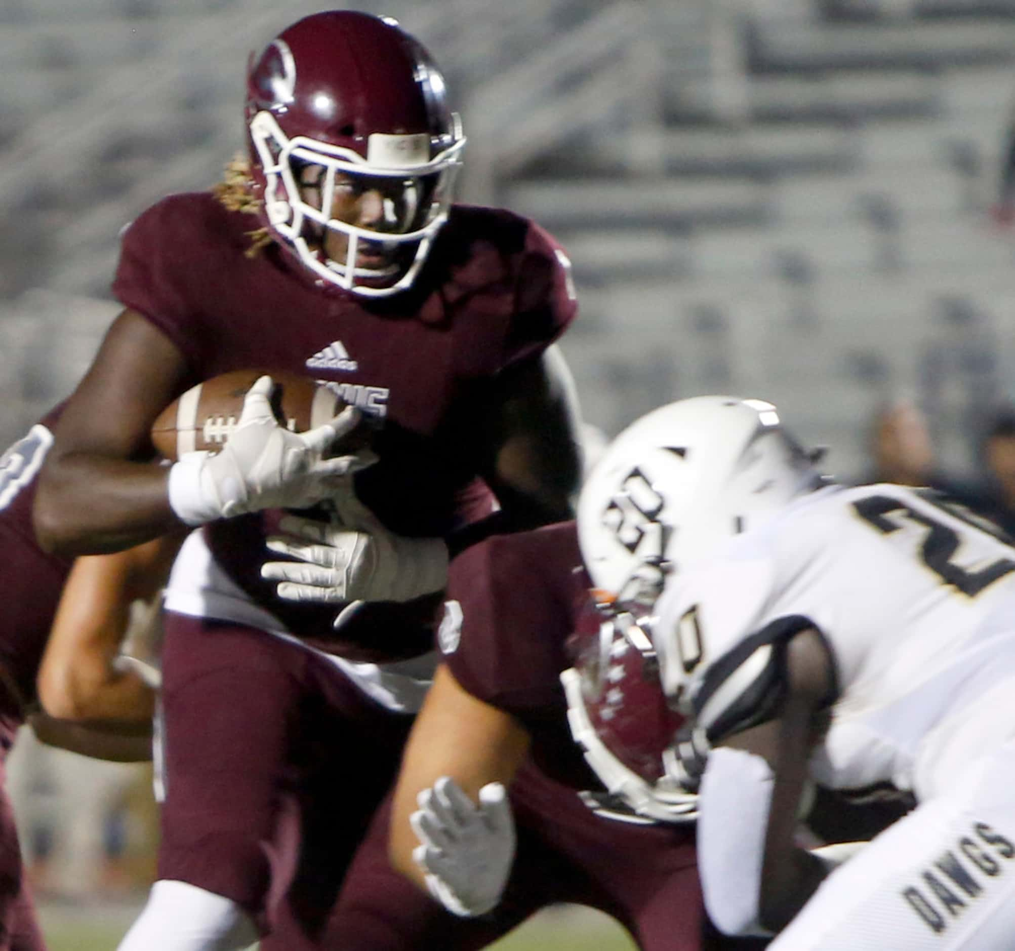 Ennis running back Jarius Jones (1) cuts inside a block past Royse City linebacker Zamien...