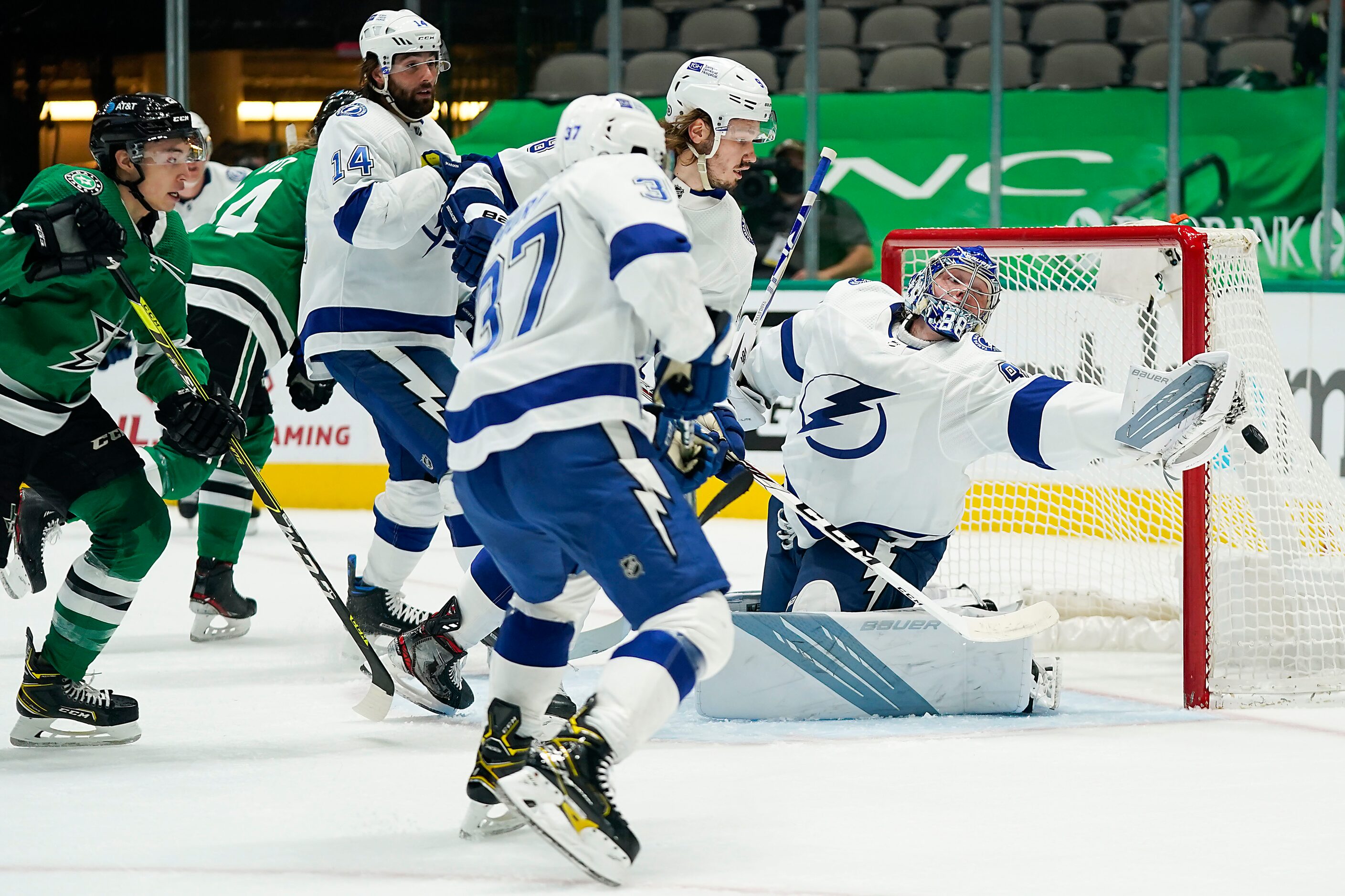 Tampa Bay Lightning goaltender Andrei Vasilevskiy (88) reaches for the puck as Dallas Stars...