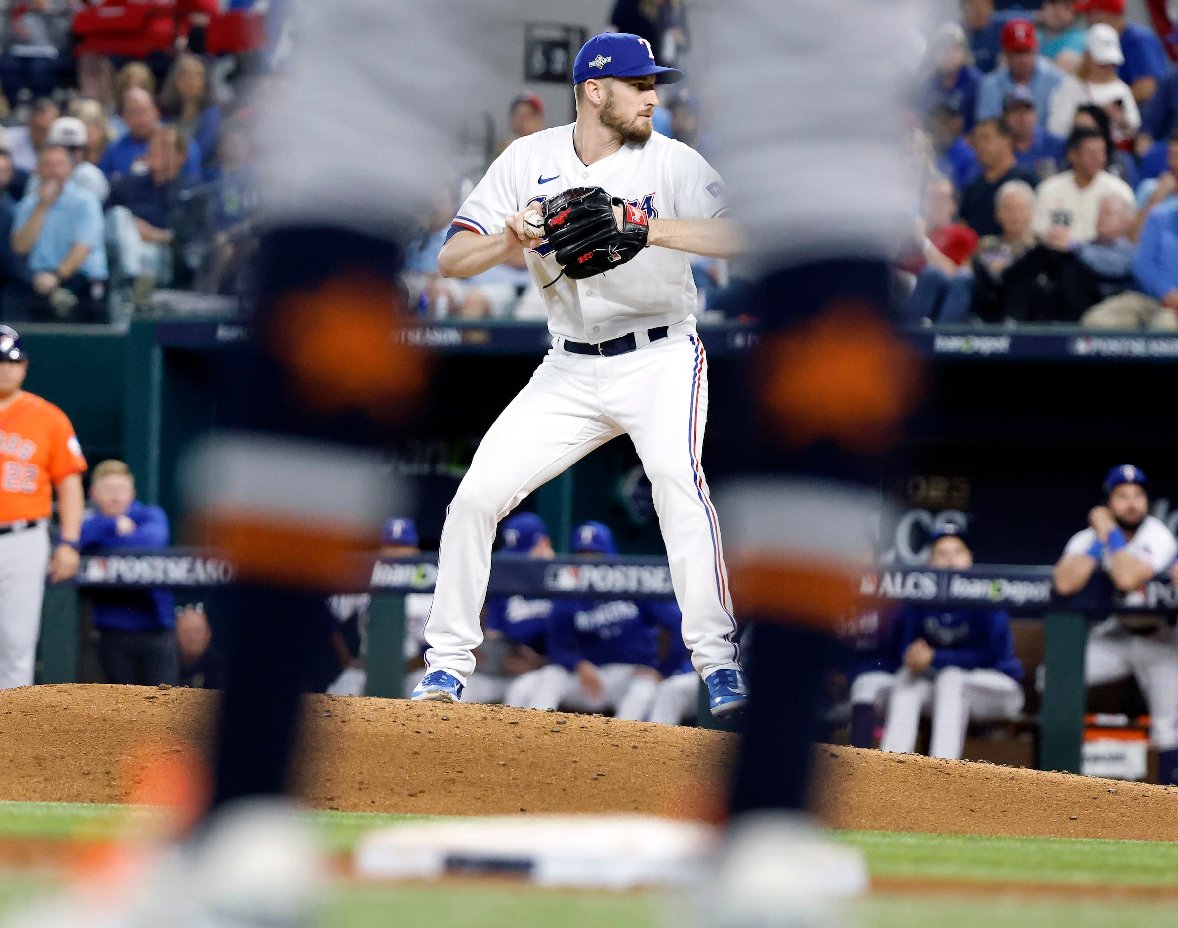 Texas Rangers relief pitcher Chris Stratton (35) is pictured pitching between Houston Astros...