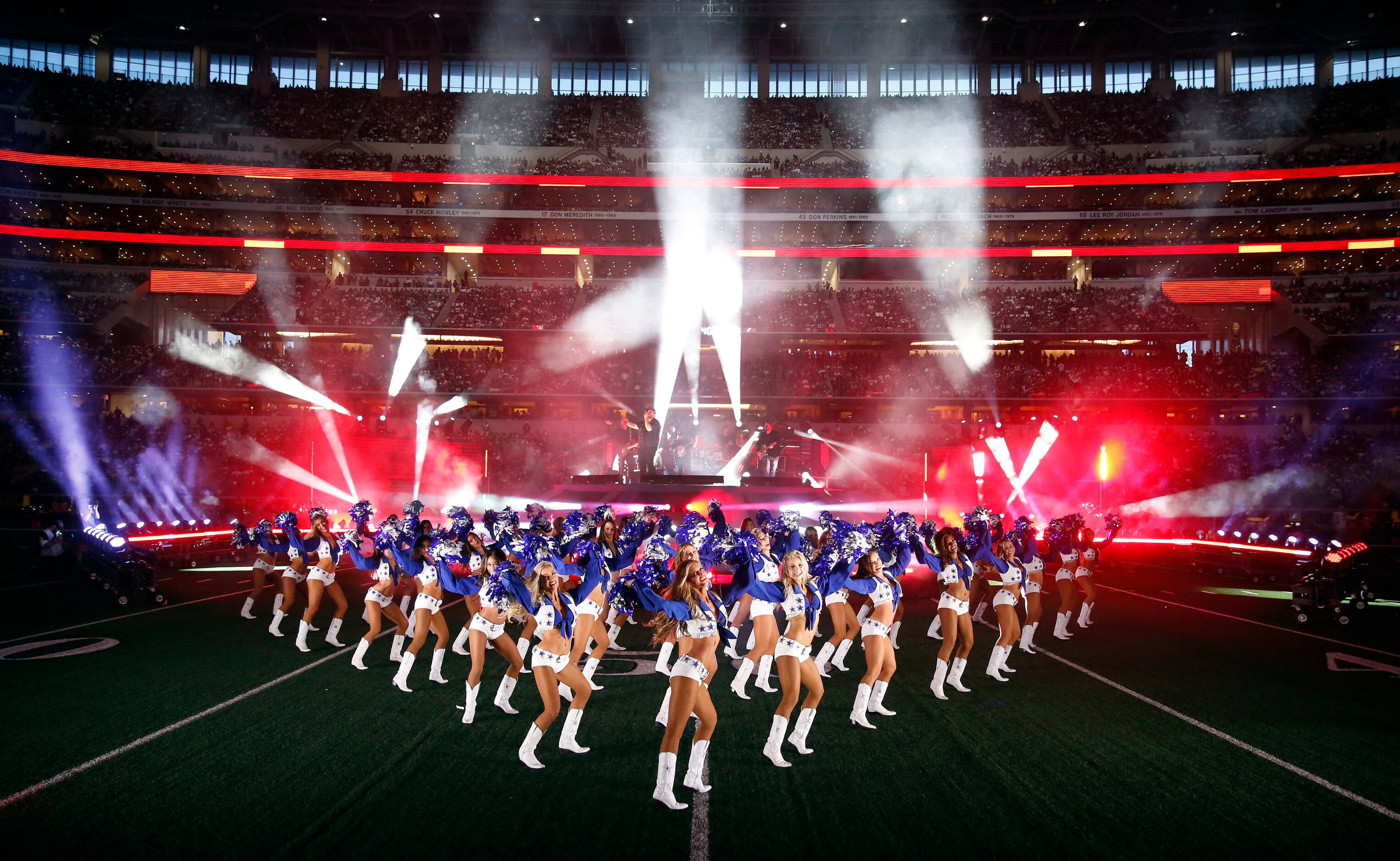 The Dallas Cowboys Cheerleaders dance during country music artist Luke Combs halftime...