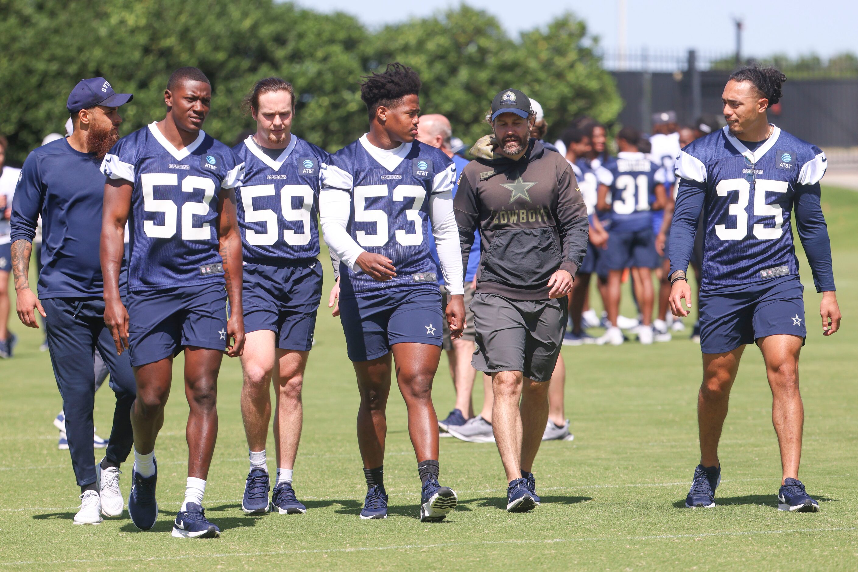 Dallas Cowboys linebackers Byron Vaughns (52), Brock Mogensen (59), Jason Johnson (53), and...