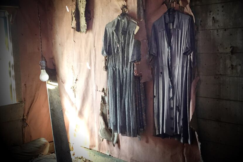 Tattered dresses still hang in an abandoned house on FM1743 near Windom, Texas in rural...