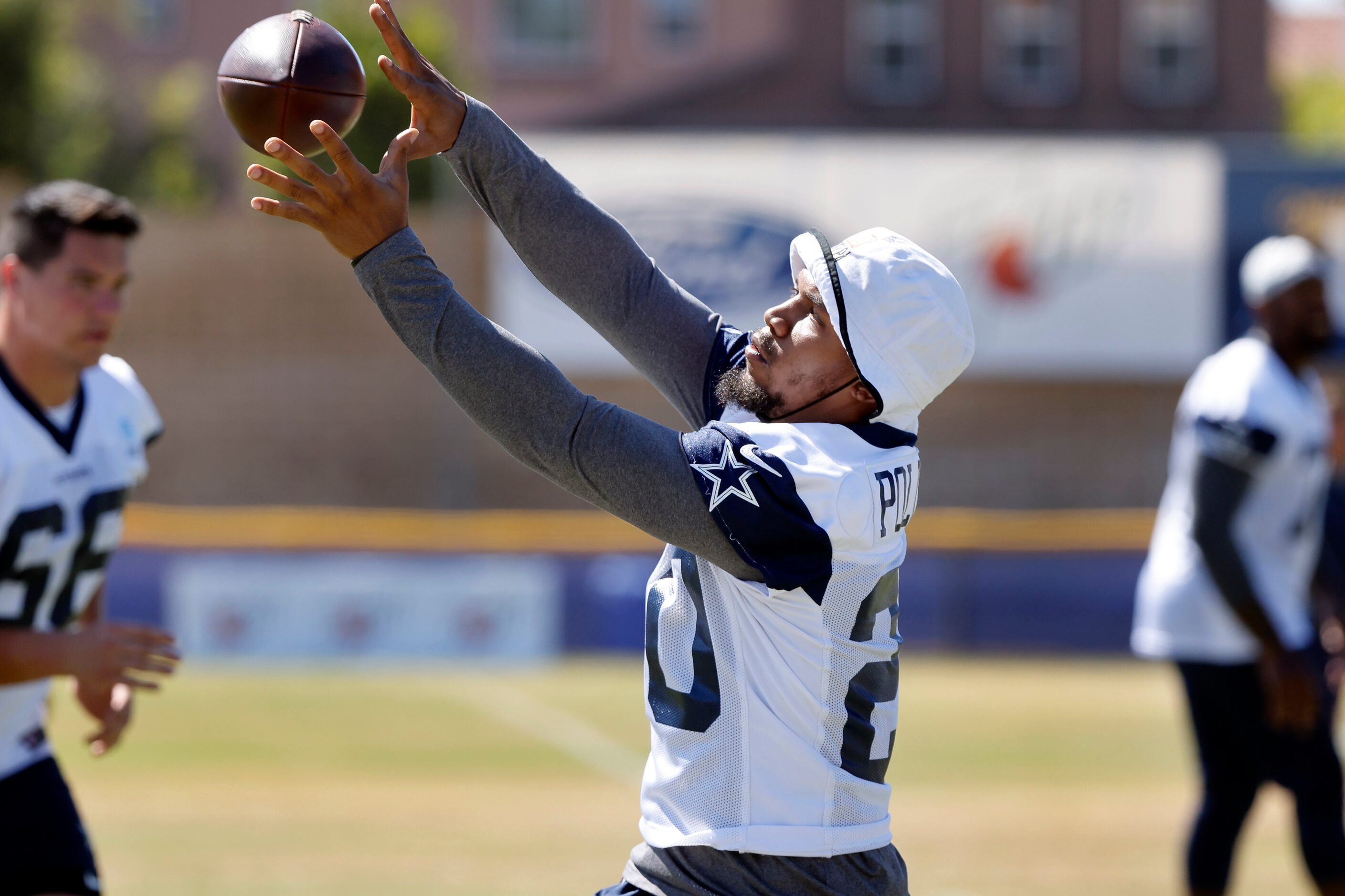 Dallas Cowboys running back Tony Pollard (20) pulls in a pass from quarterback Cooper Rush...