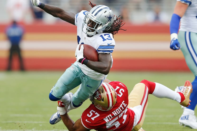 Dallas Cowboys wide receiver Lucky Whitehead (13) is tripped up by San Francisco 49ers...