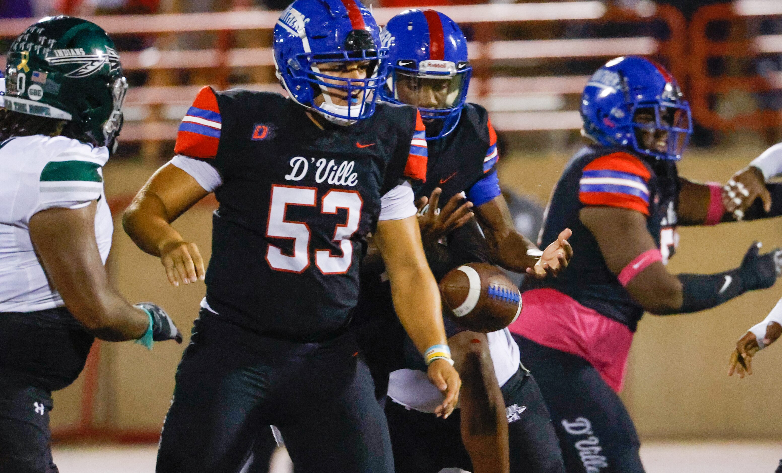 Duncanville quarterback Keelon Russell (12) watches the ball fall from his hands as he is...