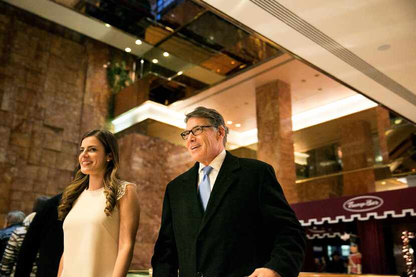 Former Texas Gov. Rick Perry walks through the lobby of Trump Tower on Fifth Avenue in New...