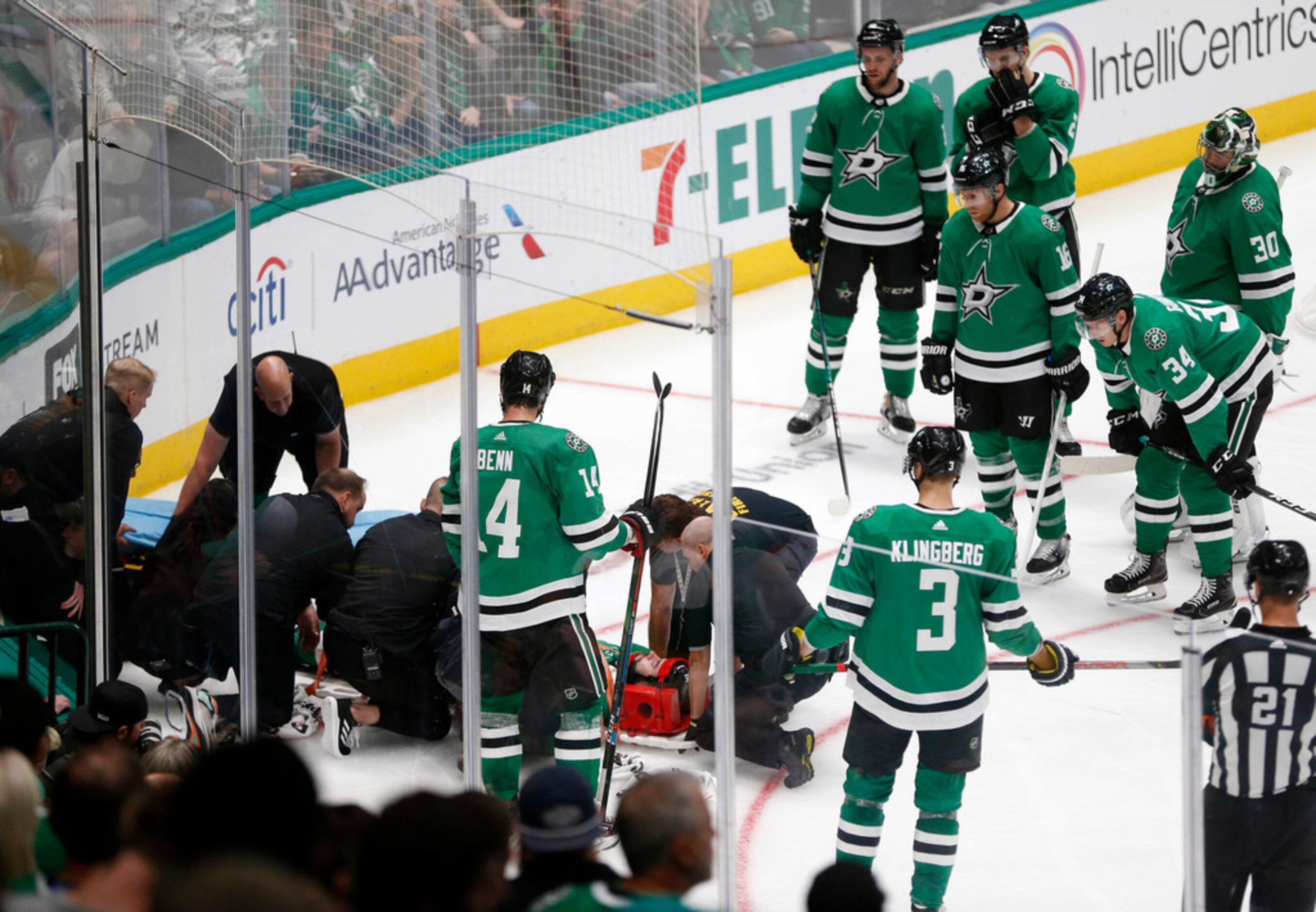 Dallas Stars defenseman Roman Polak (45) is tended to by medics as Dallas Stars players...