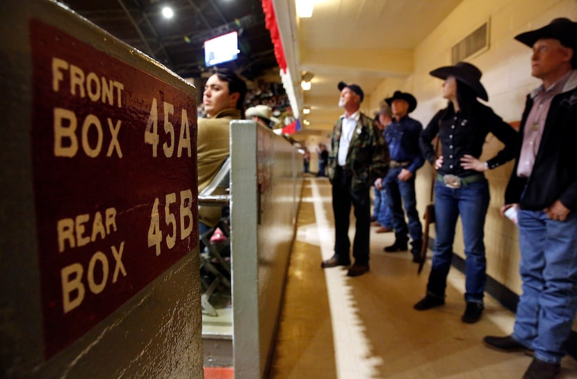 Hand-painted box sections line the wall circling Will Rogers Memorial Coliseum during the...