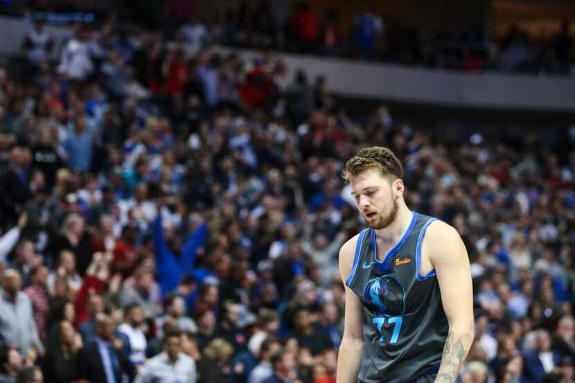 Dallas Mavericks forward Luka Doncic (77) walks off the court following a matchup between...