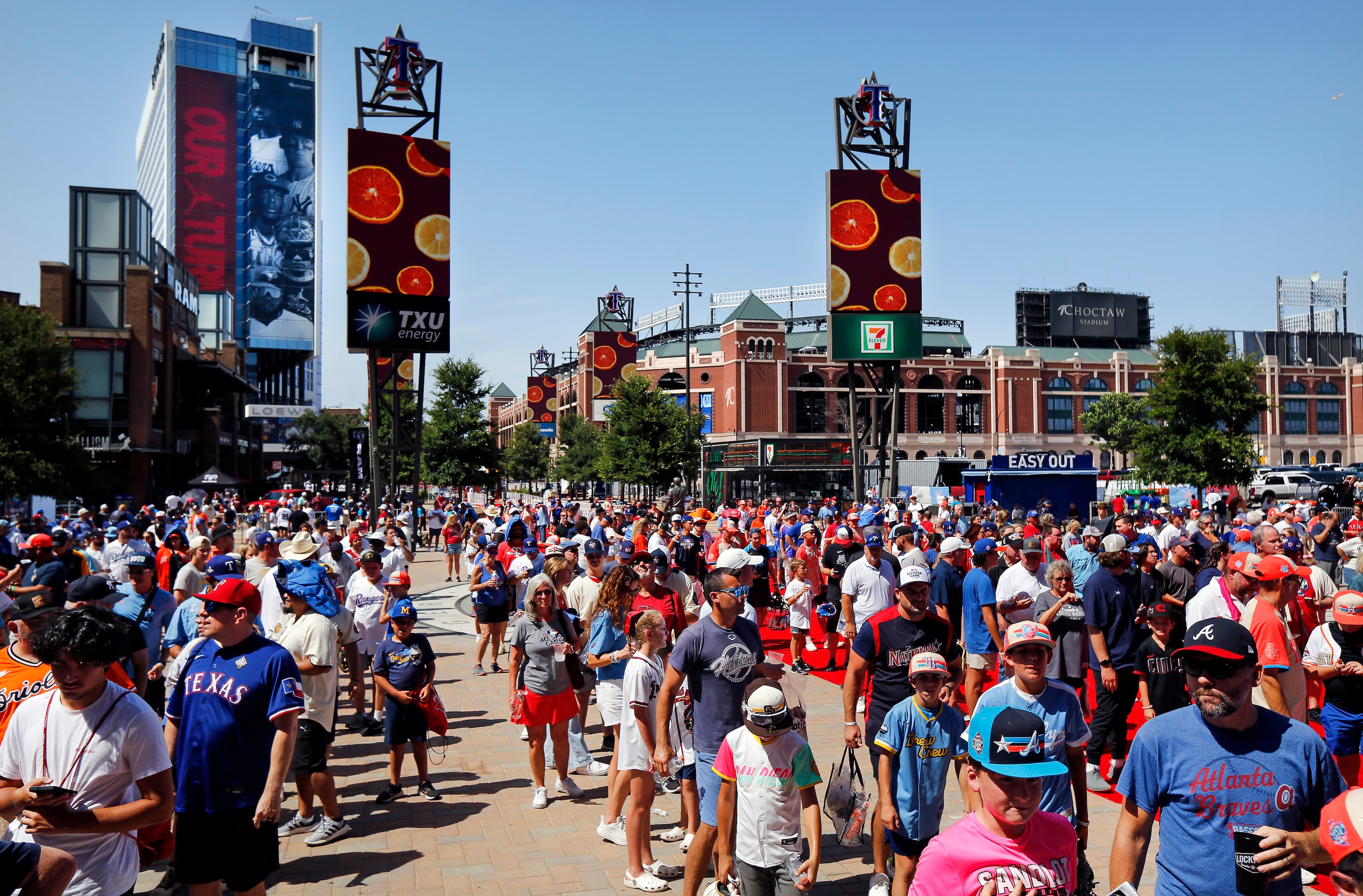 Baseball fans wait for the doors to open for the MLB All-Star Game at Globe Life Field in...