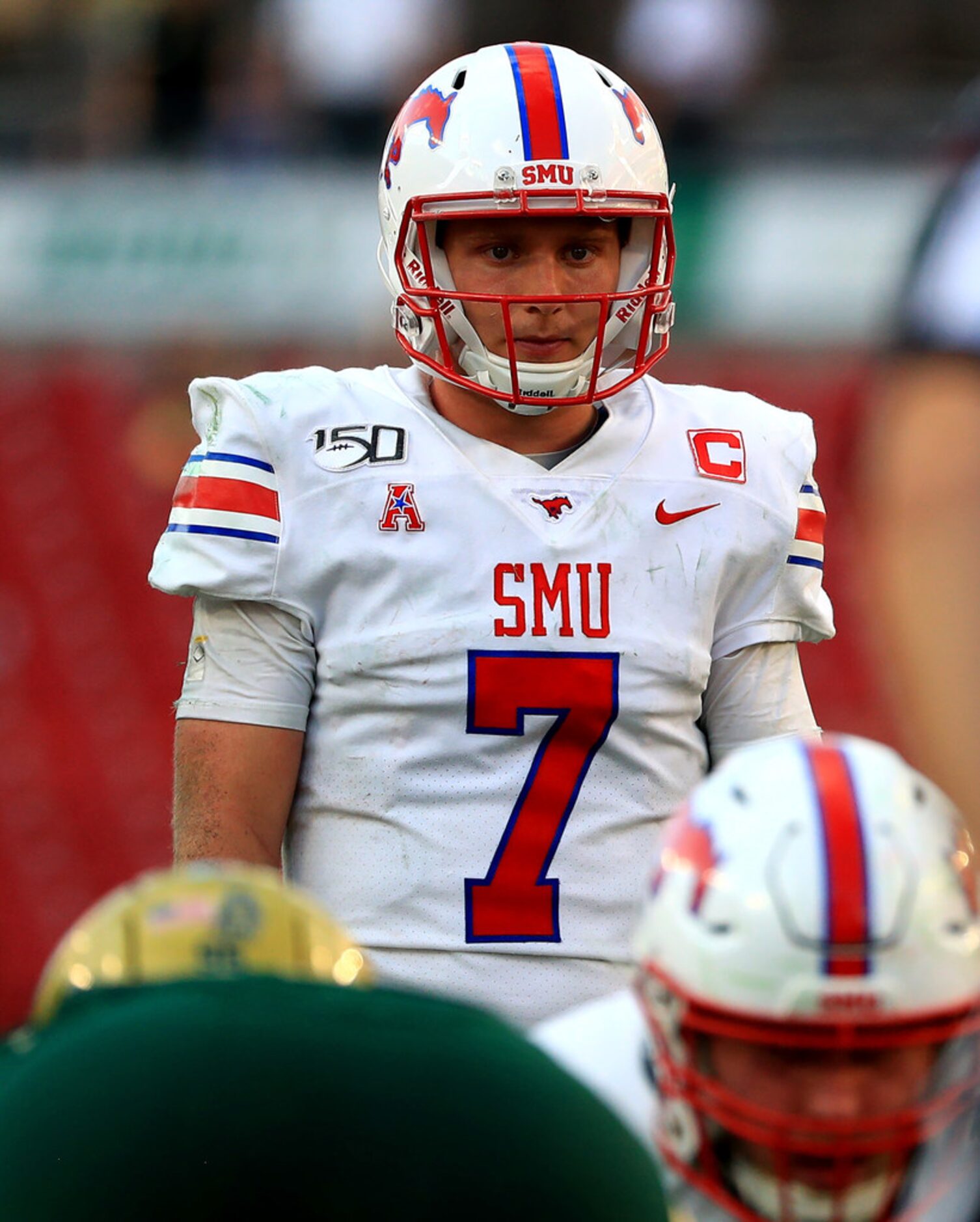 TAMPA, FLORIDA - SEPTEMBER 28: Shane Buechele #7 of the Southern Methodist Mustangs calls a...