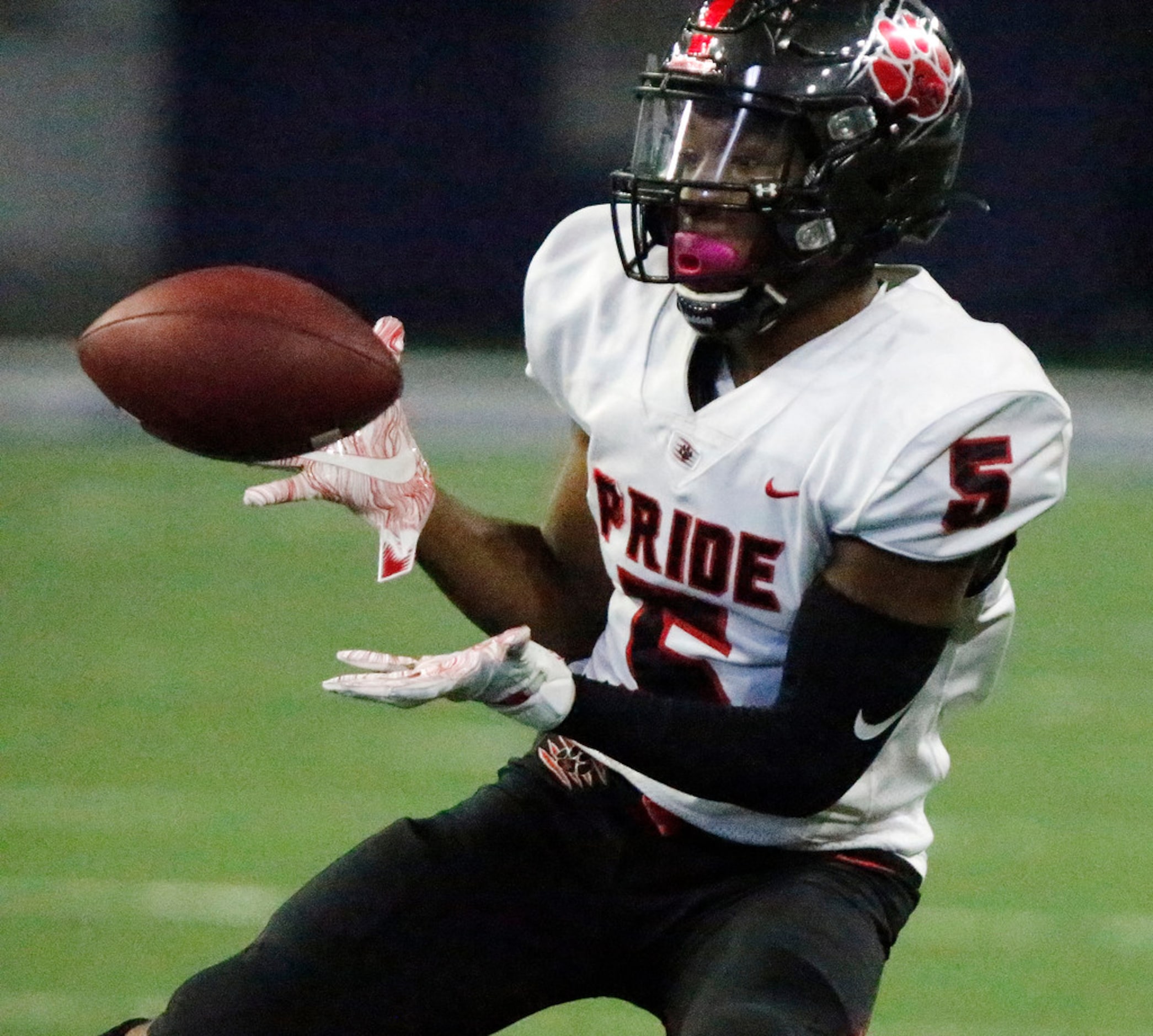 Colleyville Heritage High School wide receiver Chad Turner (5) catches a pass during the...