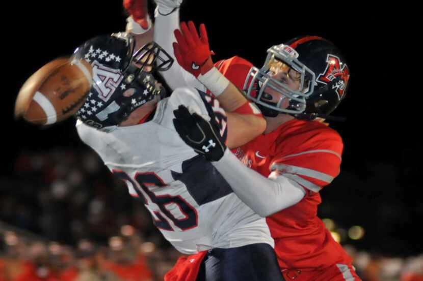 Allen receiver Cameron Calcote (15) huals in a pass in front of Cedar Hill defender Jared...