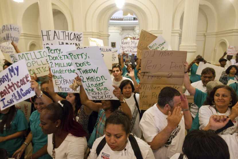 Hundreds of Texans unhappy at Gov. Rick Perry’s shunning of billions in federal funds to...
