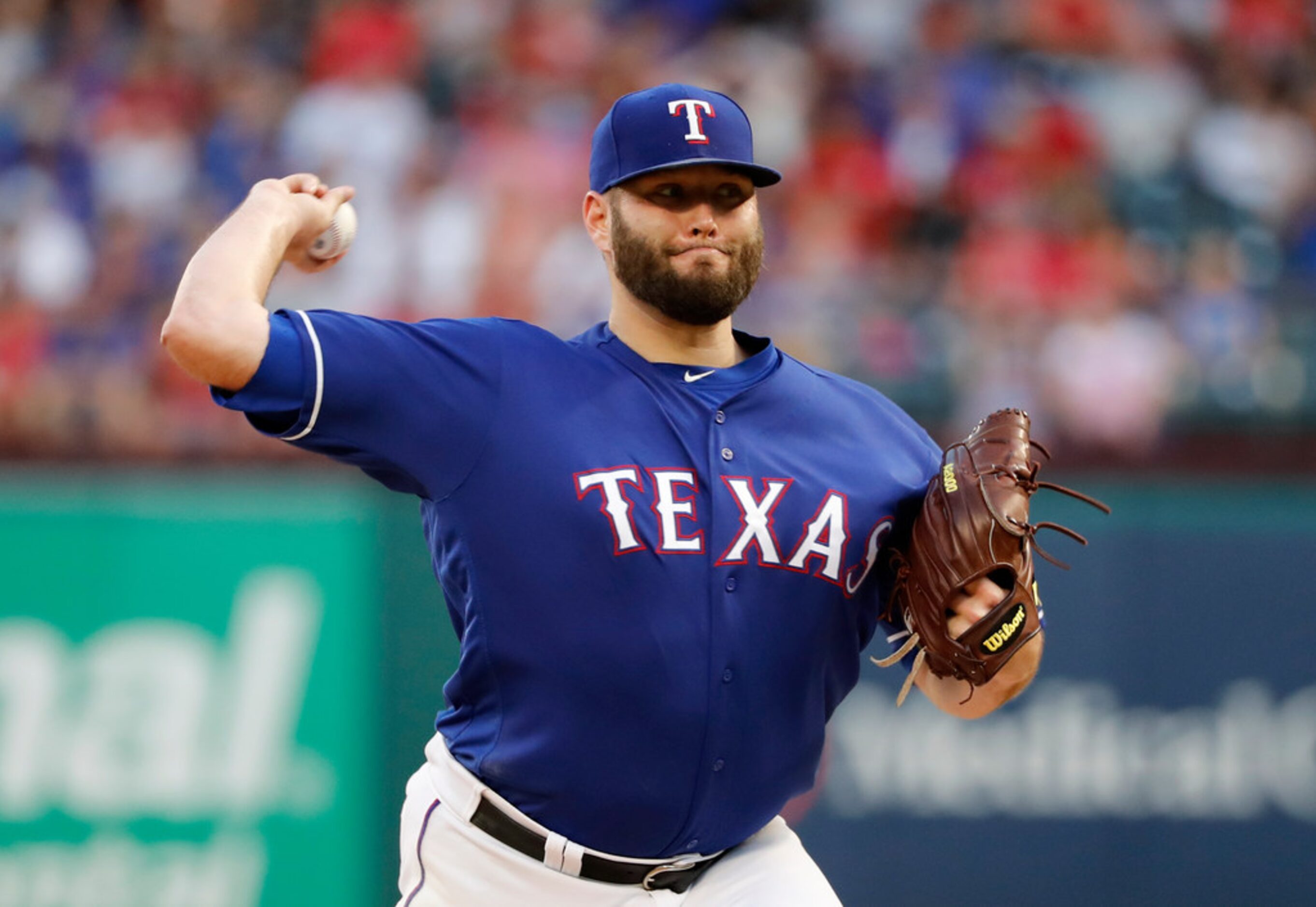 Texas Rangers starting pitcher Lance Lynn throws to the Chicago White Sox in the first...