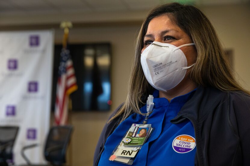 Nurse manager Dolores Diaz speaks with The Dallas Morning News after receiving a dose of the...