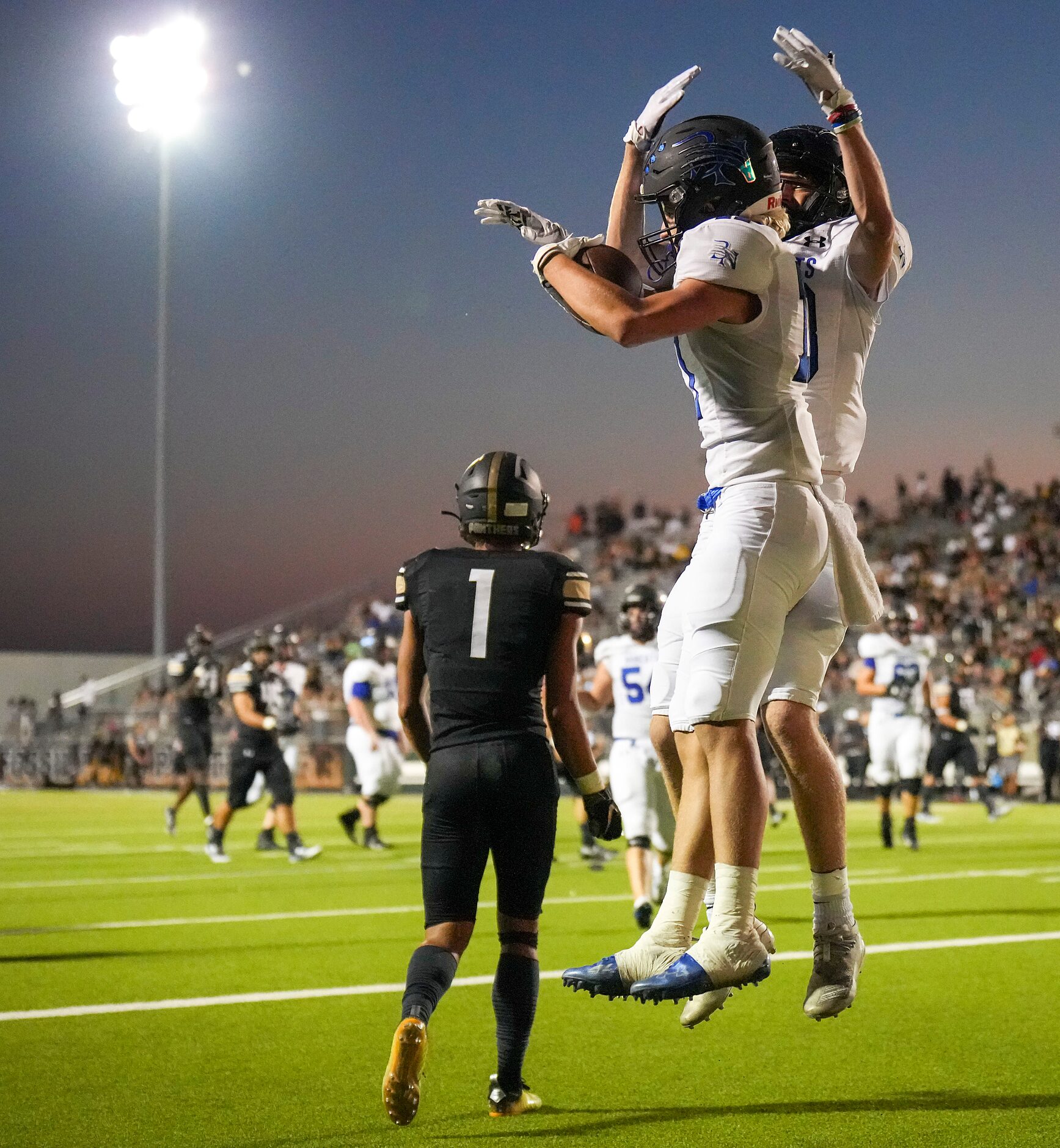 Trophy Club Byron Nelson’s Landon Farco (front) celebrates with teammate Kurt Ippolito after...