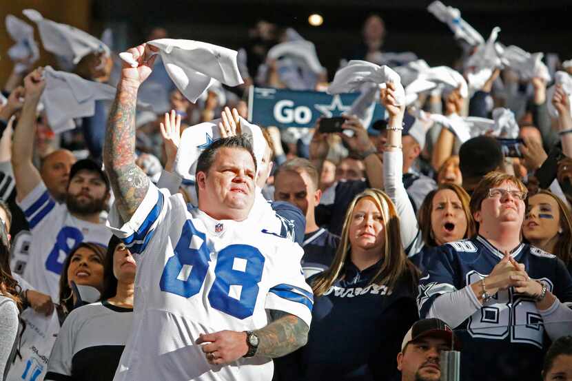 Cowboys fans cheer their team in the first quarter during the Detroit Lions vs. the Dallas...