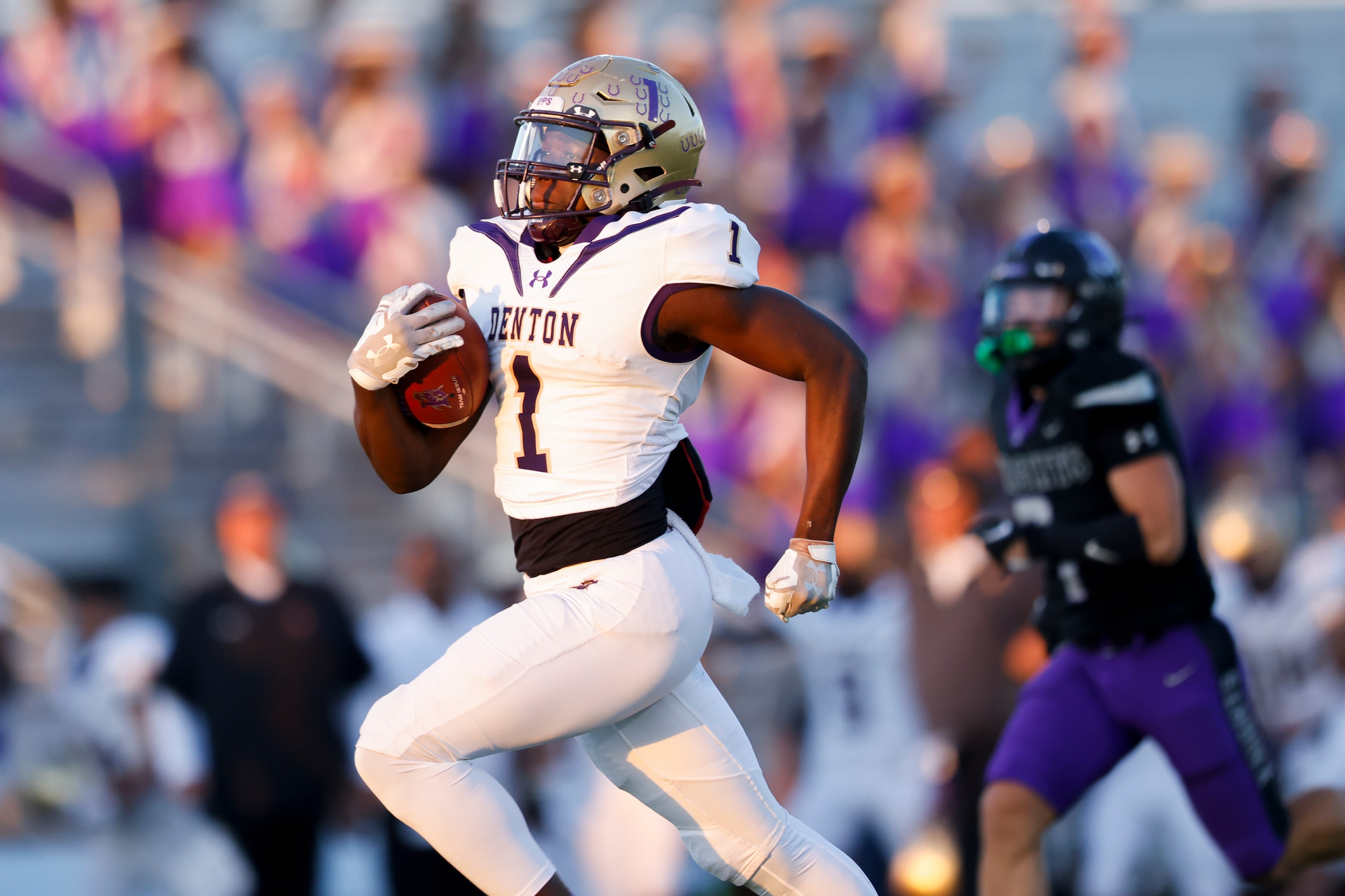 Denton’s running back Coco Brown (1) rushes 78 yards against the Frisco Independence defense...