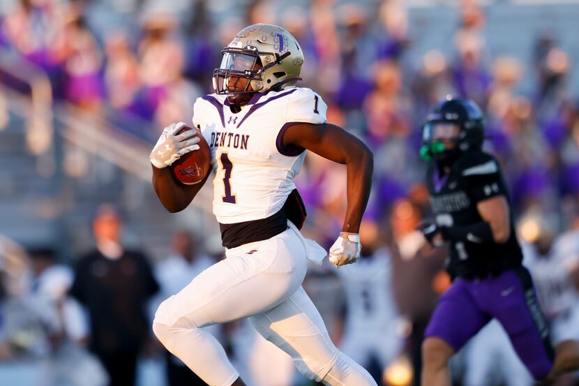 Denton’s running back Coco Brown (1) rushes 78 yards against the Frisco Independence defense...