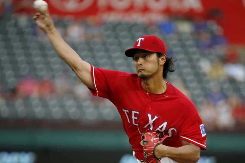Texas Rangers starting pitcher Yu Darvish throws a pitch against Oakland Athletics during...