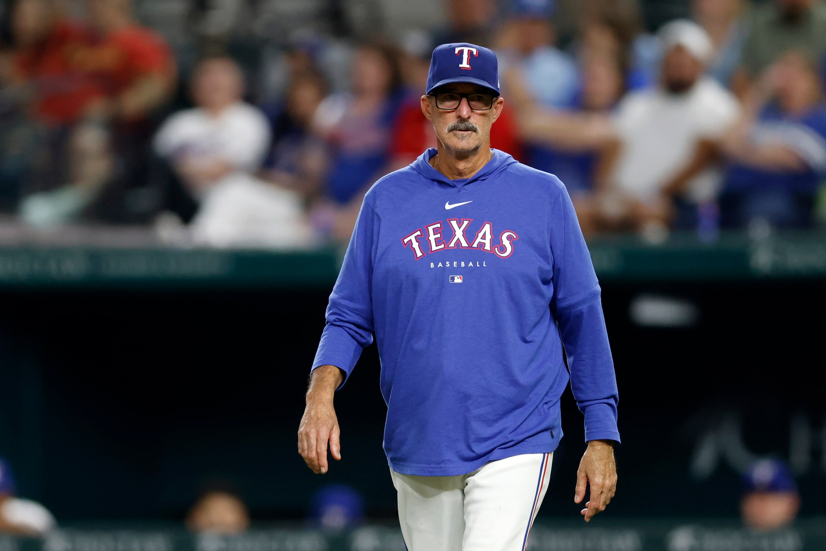 Texas Rangers pitching coach Mike Maddux visits the mound during the ninth inning against...