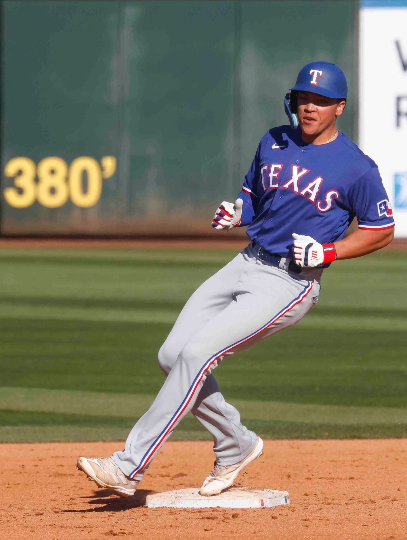 Texas Rangers outfielder Dustin Harris reaches the second base after a double during the...