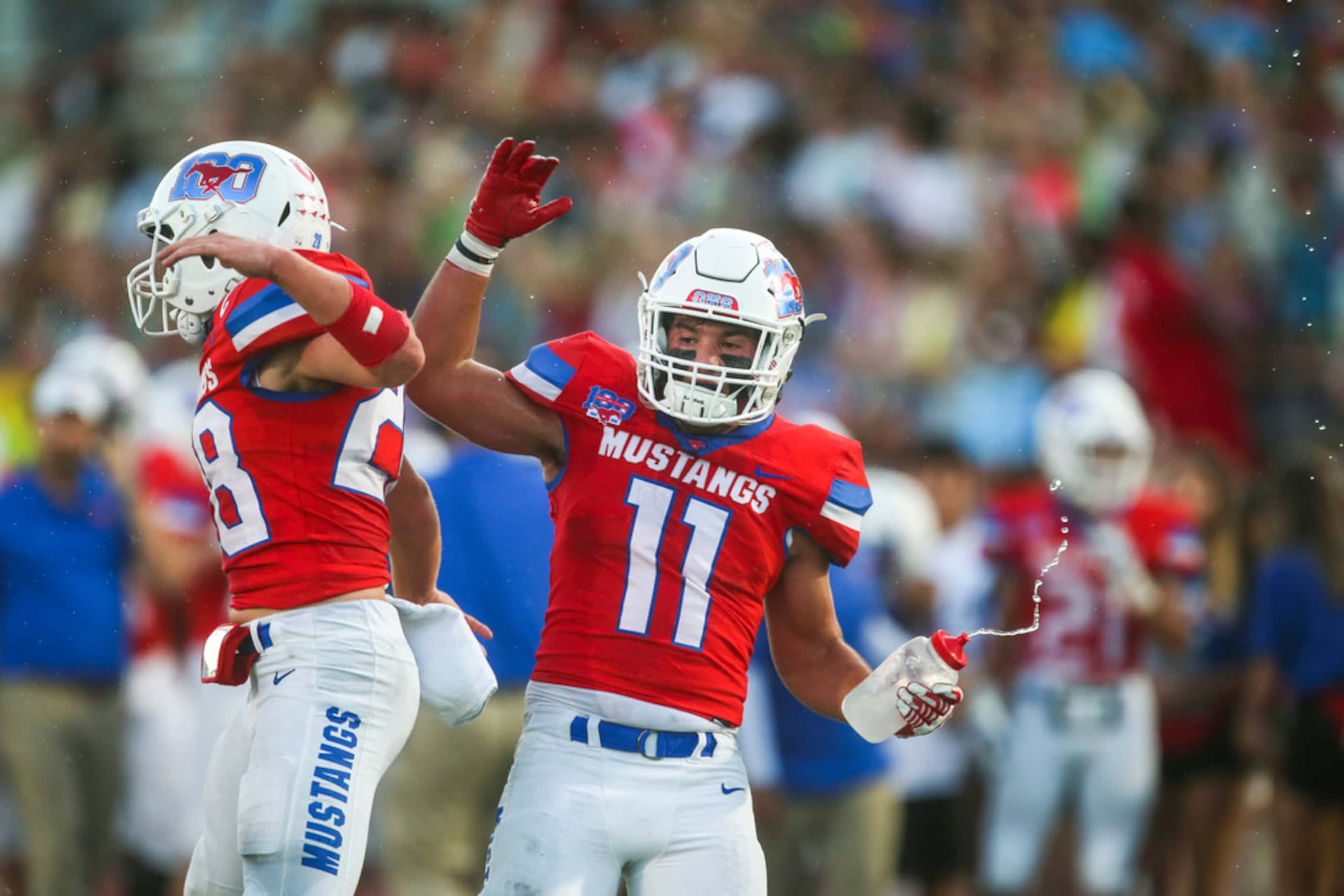 Grapevine defensive back Blake Maserang (left) celebrates with linebacker Kade Keeling...