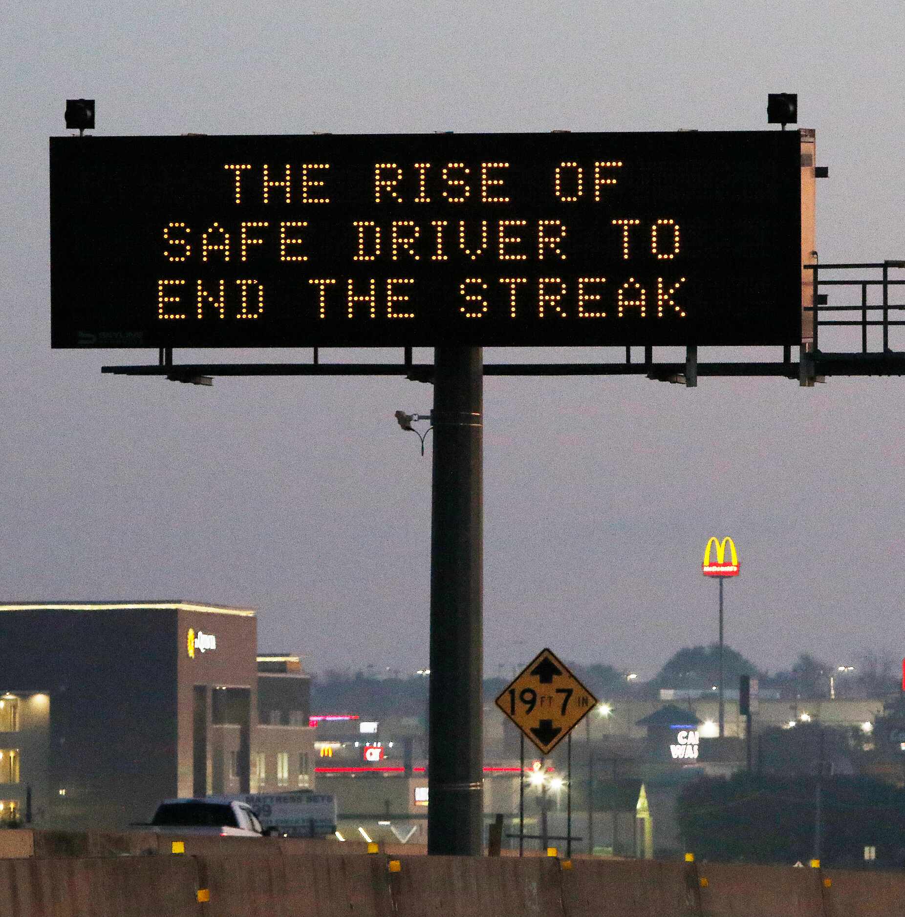 TXDOT's Safe Driver sign" THE RISE OF SAFE DRIVER TO END THE STREAK" on Highway 67 in Dallas...
