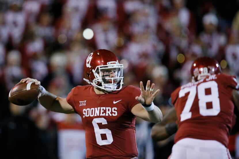 Oklahoma quarterback Baker Mayfield (6) throws in the first quarter of an NCAA college...
