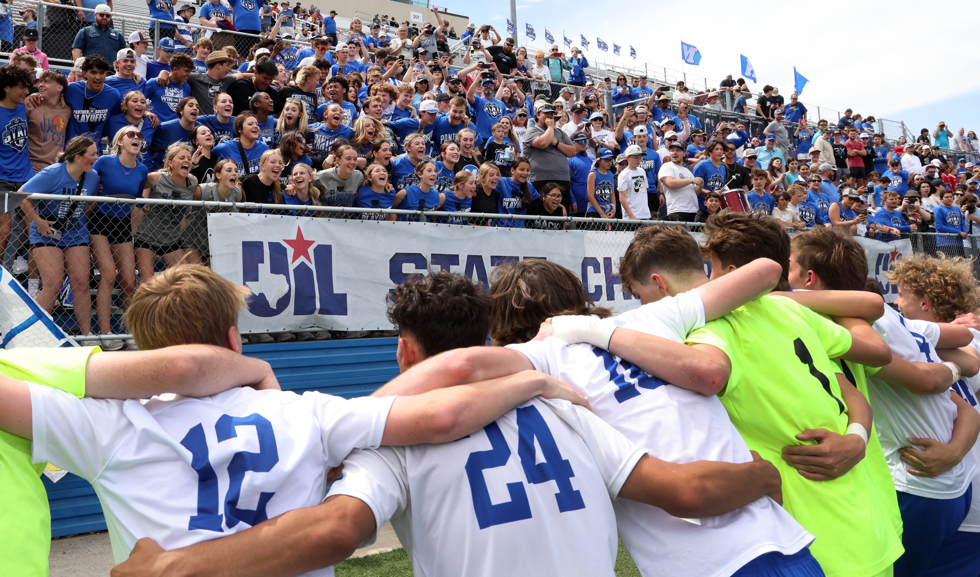  Midlothian players dance as fans sing "Midlo dance", a school tradition  after winning an...