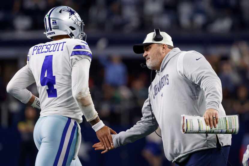 Dallas Cowboys head coach Mike McCarthy congratulates Dak Prescott after a touchdown during...