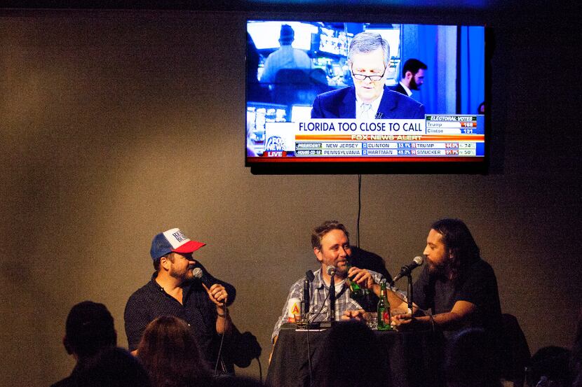 From left: Matt Bearden, Mike MacRa, and Jake Flores, local comedians, tell jokes during a...
