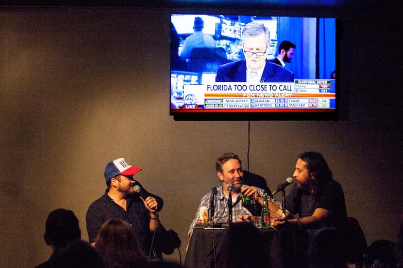 From left: Matt Bearden, Mike MacRa, and Jake Flores, local comedians, tell jokes during a...