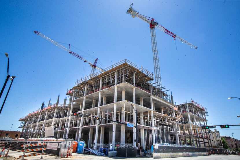 A project under construction in downtown Dallas' East Quarter is one of more than two dozen ...
