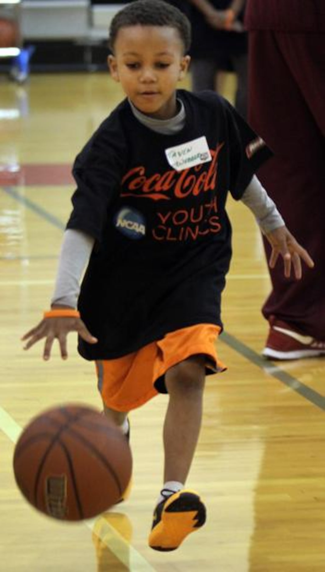 
Taven Webber,8, of Grand Prairie, dribbles as he learns ball control with local youngsters...