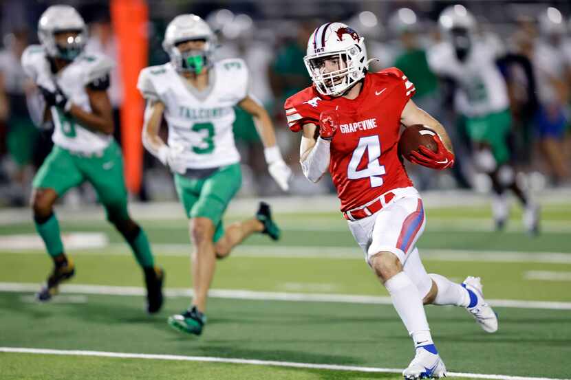 Grapevine running back Parker Polk (4) races to the end zone for a touchdown after catching...