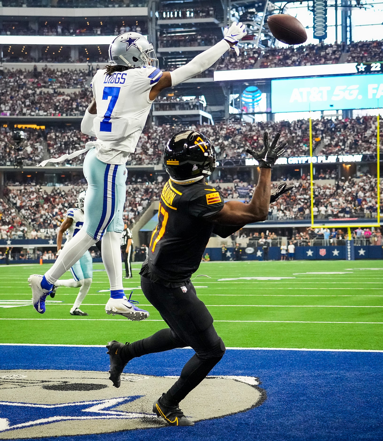 Dallas Cowboys cornerback Trevon Diggs (7) breaks up a pass intended for Washington...