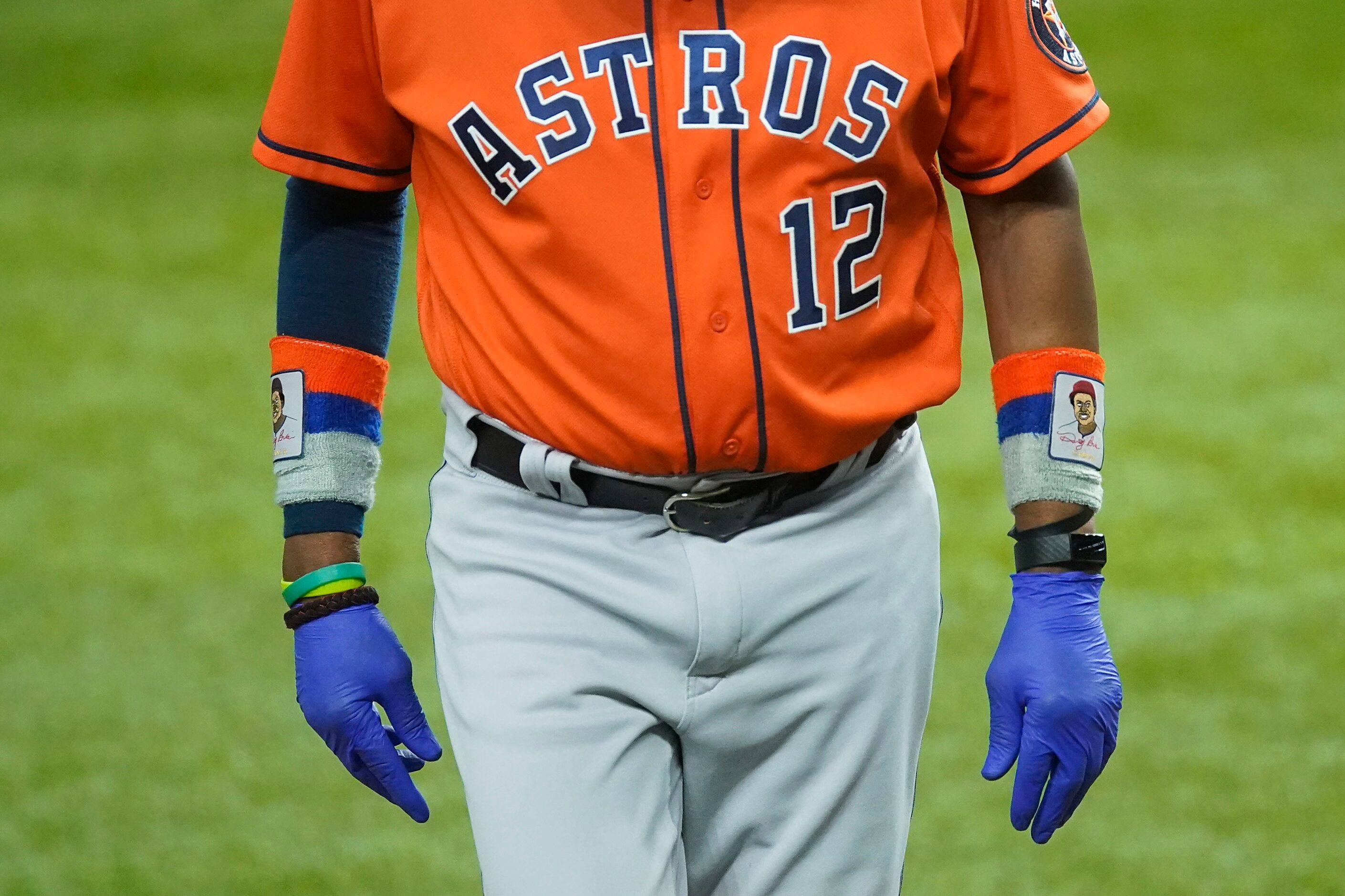 Houston Astros manager Dusty Baker wears gloves as a precaution against the coronavirus as...