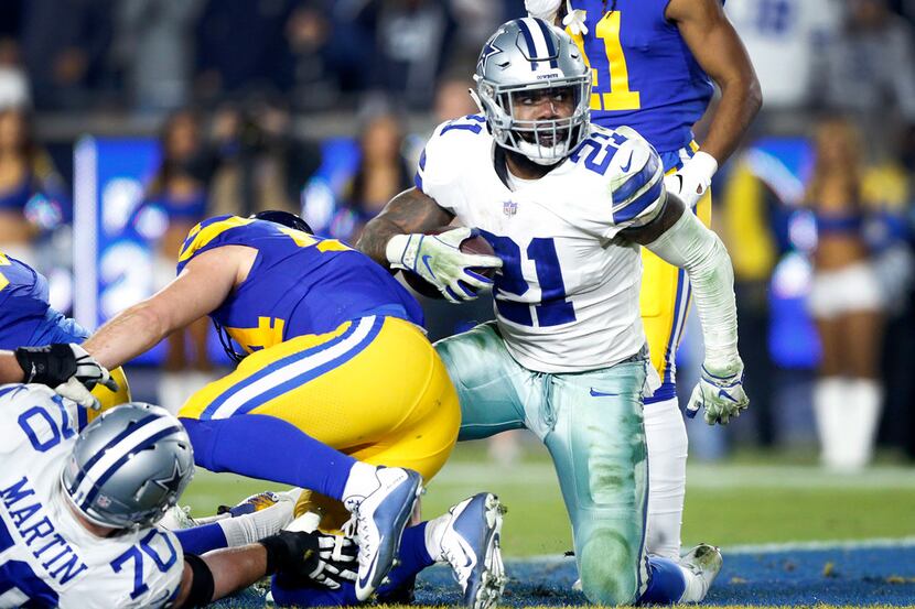 Dallas Cowboys running back Ezekiel Elliott (21) scores a third quarter touchdown against...