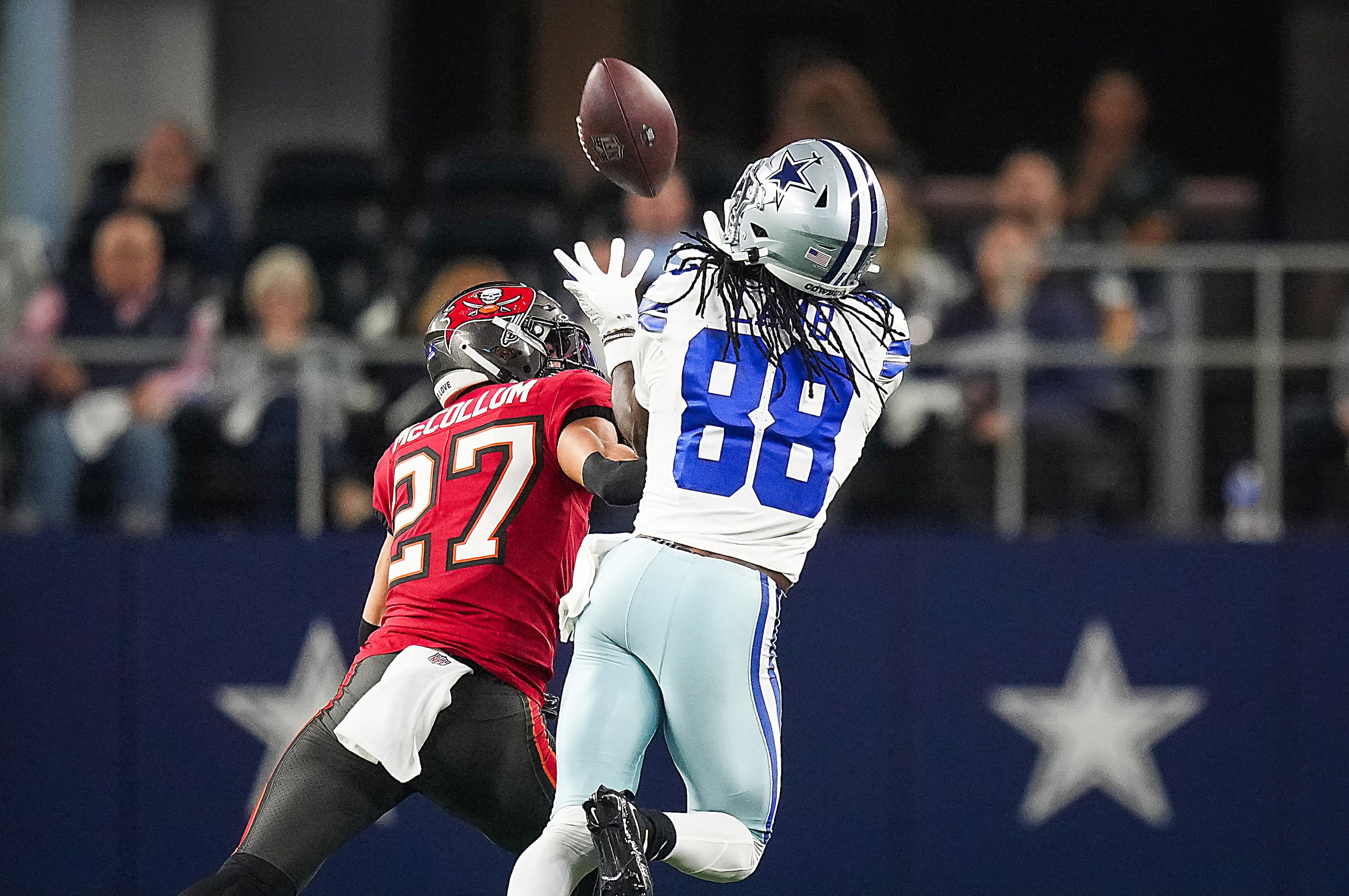 Dallas Cowboys wide receiver CeeDee Lamb (88) hauls in a long pass as Tampa Bay Buccaneers...