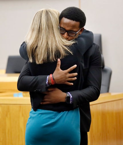 Botham Jean's younger brother Brandt Jean hugs Amber Guyger after a jury sentenced her to 10...