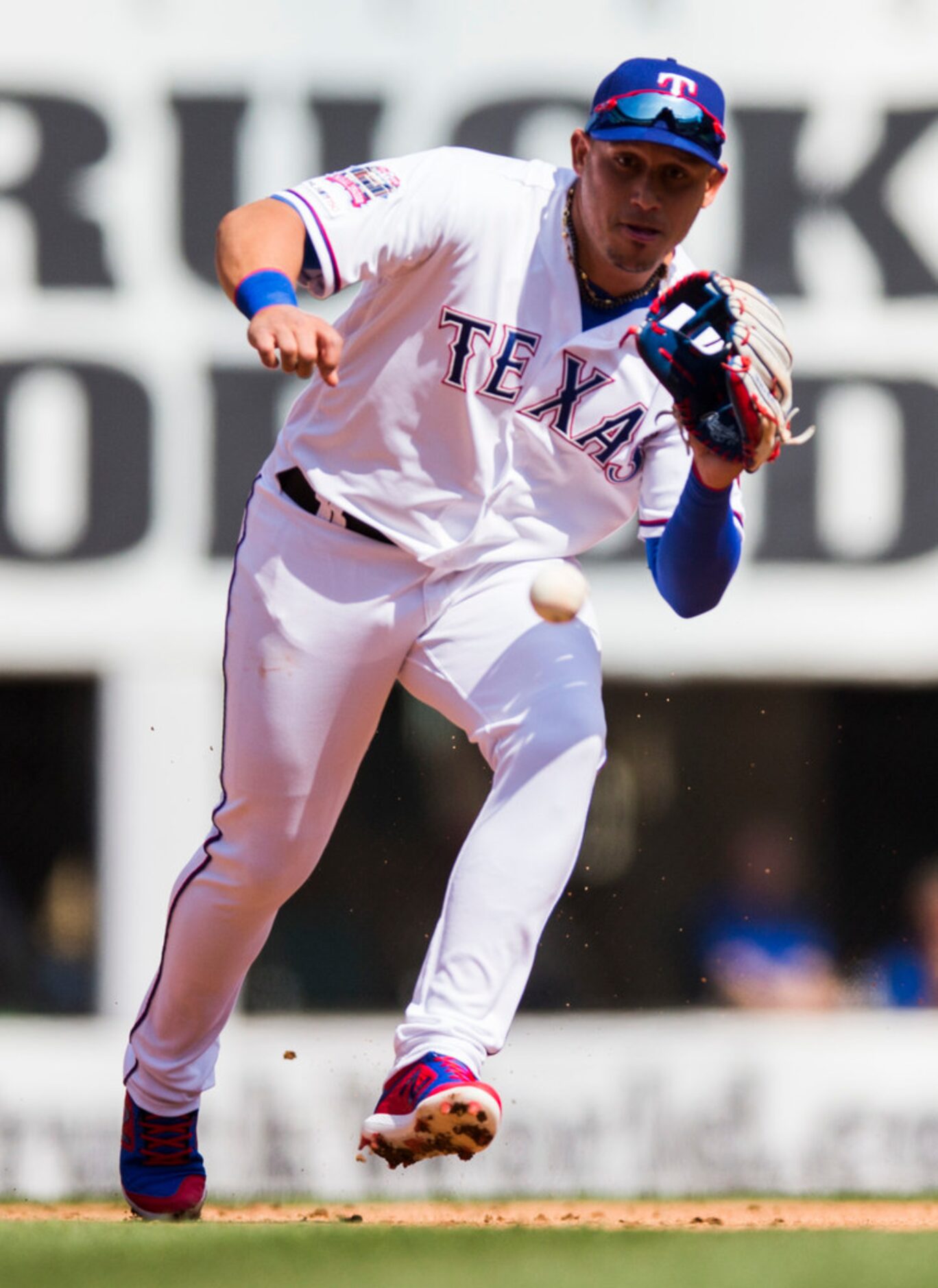 Texas Rangers third base Asdrubal Cabrera (14) field a grounder during the first inning of...