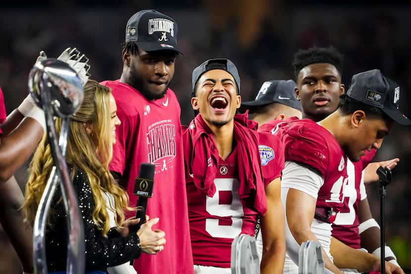 Alabama quarterback Bryce Young (9) celebrates with teammates during the trophy presentation...