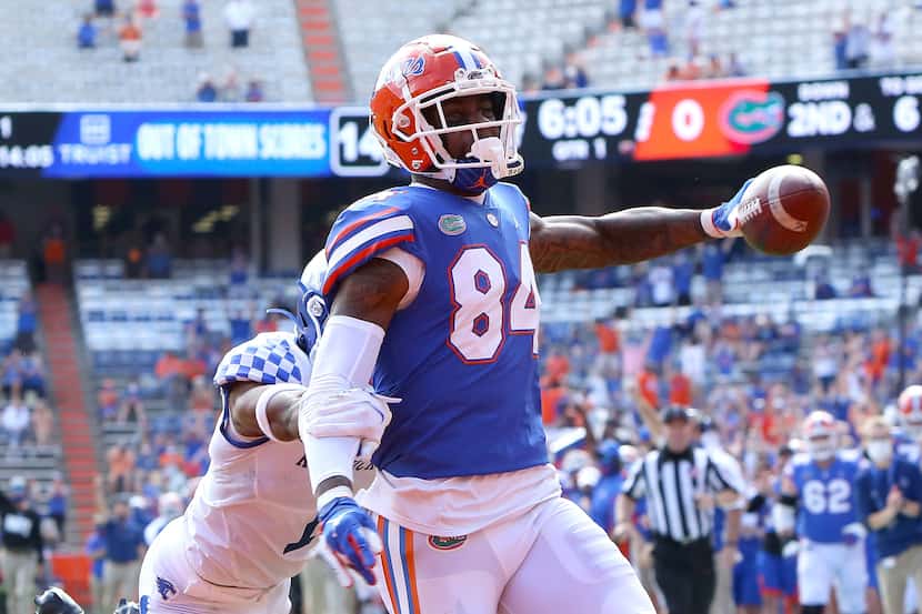 FILE - Florida Gators tight end Kyle Pitts (84) scores a touchdown during an NCAA college...